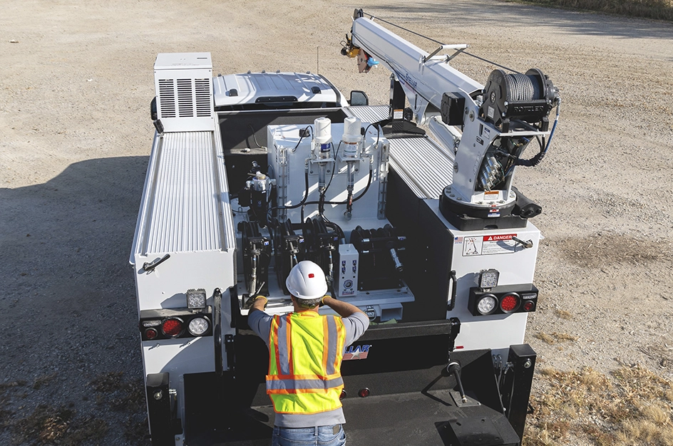 Worker on the back of TMAX truck body