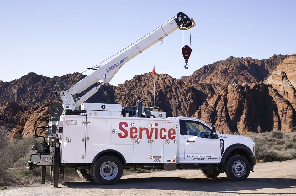 TMAX service truck with crane attachment in the hills of Utah