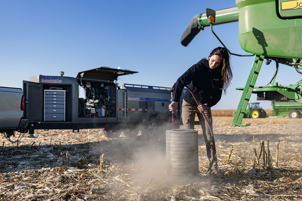 990DLX in the field with person in front