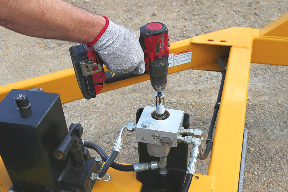 Close up of an orange cordless drill pump