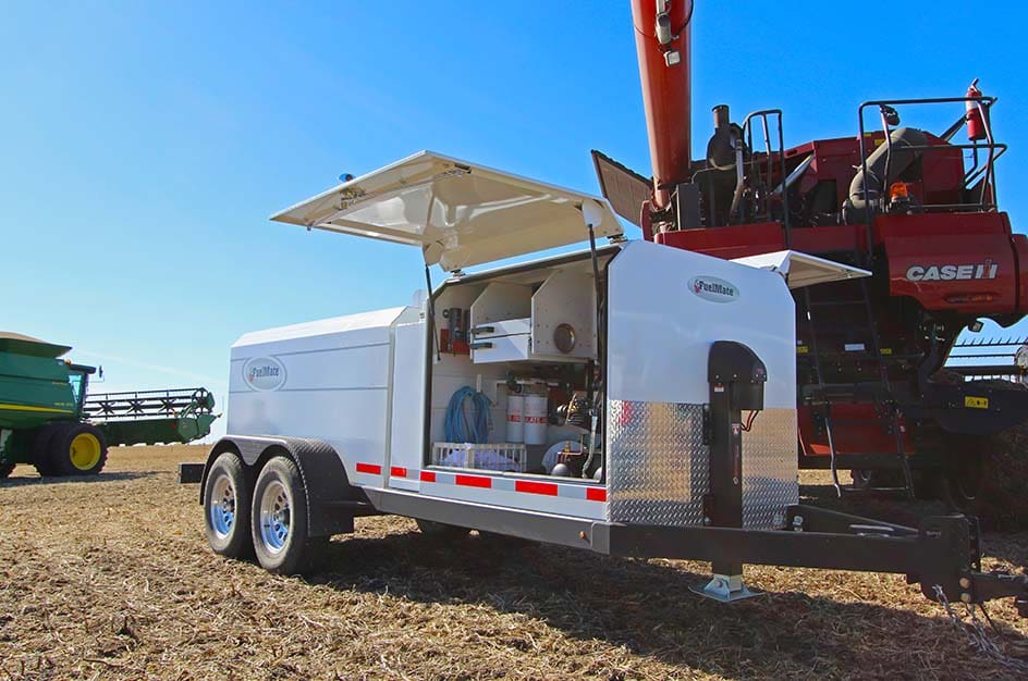 FuelMate 990DLX Deluxe Trailer in field by combine