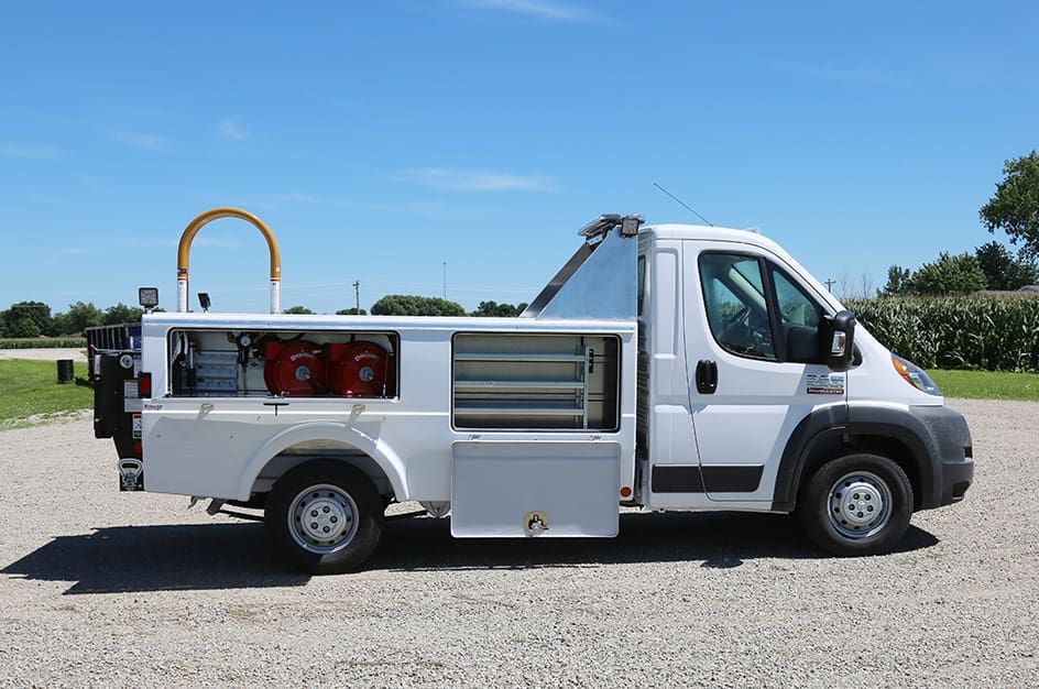White 1004 Tire Service Truck, right-side view with open tool compartments