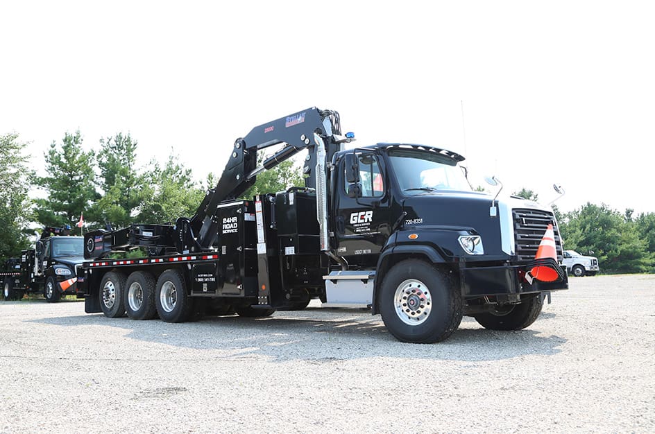 Black TM16160/28000 Large OTR Tire Service Truck, front-right view