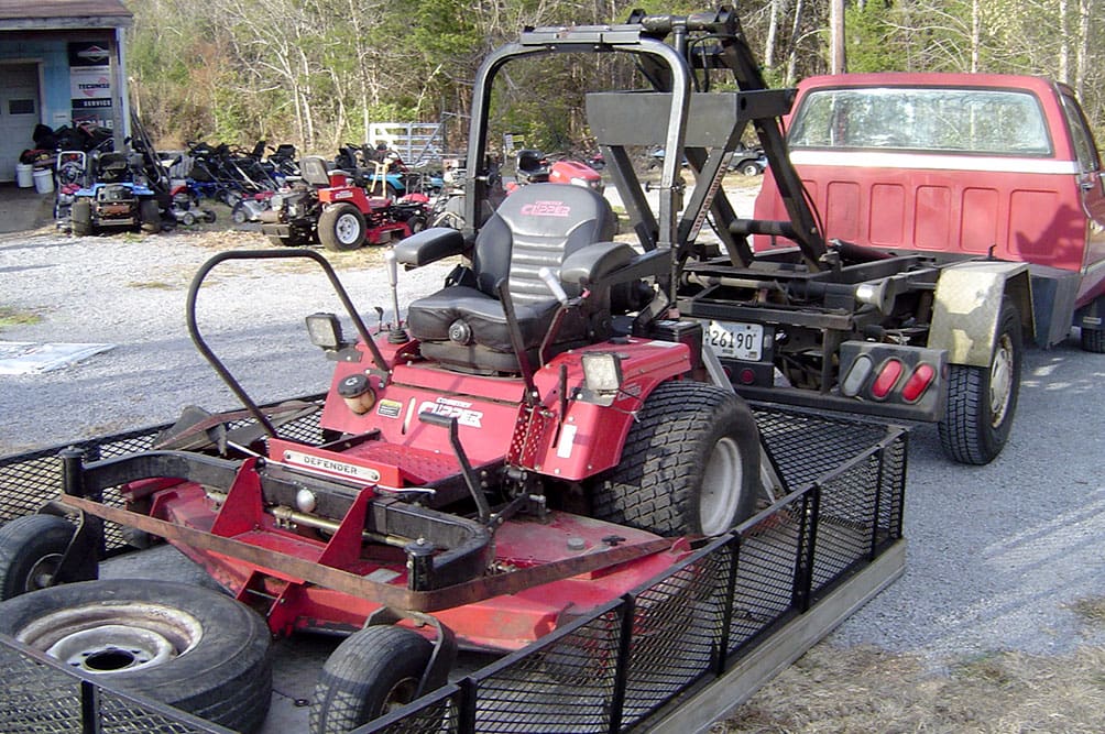 1990 Stellar Hooklift. Flatbed on the ground.