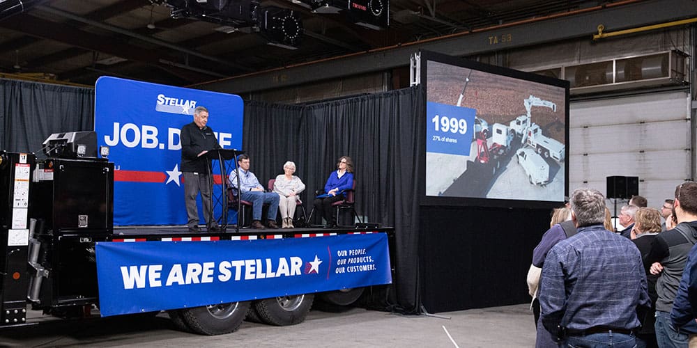 President Dave Z announcing that Stellar is 100% employee owned while standing on a trailer