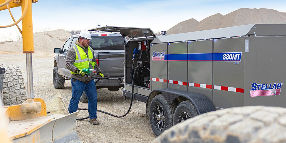 Technician fueling equipment in a quarry.