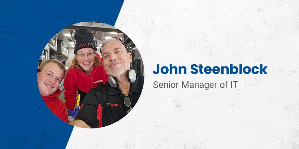 Employee spotlight featuring John Steenblock, Senior IT Manager and Garner volunteer paramedic, smiling with two colleagues inside an ambulance.