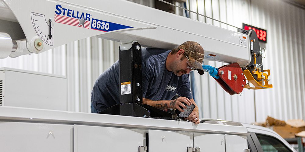 Steller employee working on a mechanic truck.
