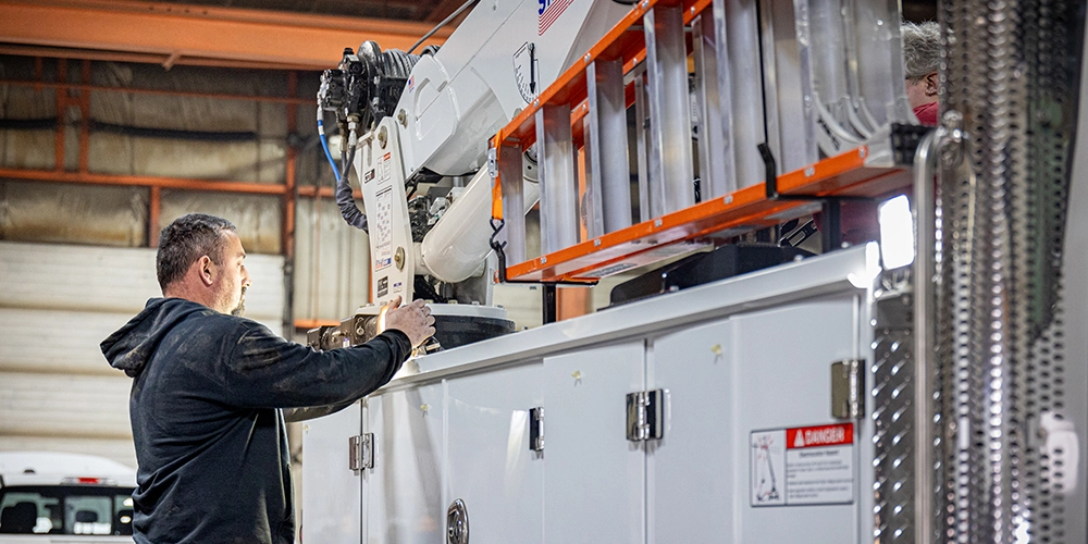 Stellar employee working on a mechanic truck